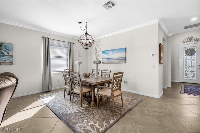 dining room featuring light tile patterned floors, ornamental molding, and an inviting chandelier