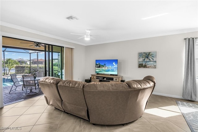 living room with crown molding, light tile patterned flooring, and ceiling fan