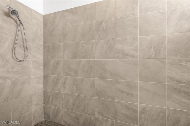 bathroom with a tile shower