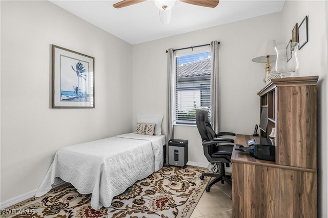 bedroom featuring ceiling fan and light tile patterned floors