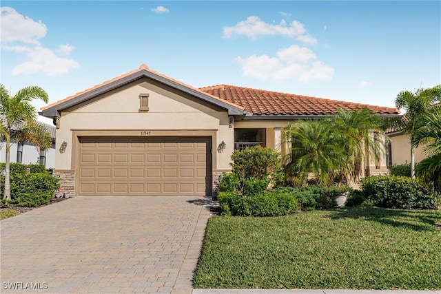 view of front facade with a garage and a front lawn