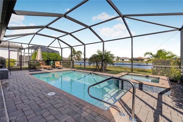 view of pool with a lanai, a water view, an in ground hot tub, and a patio