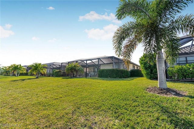 view of yard featuring glass enclosure