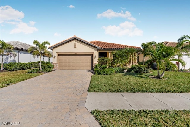 view of front of home featuring a garage and a front lawn