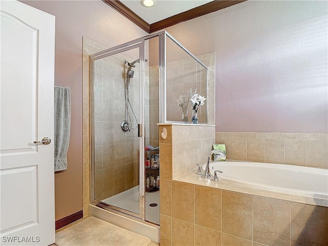 bathroom featuring separate shower and tub and crown molding