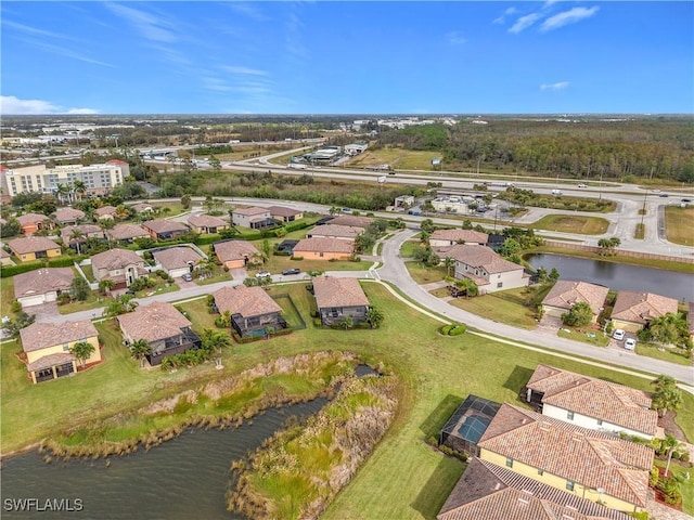 drone / aerial view with a water view