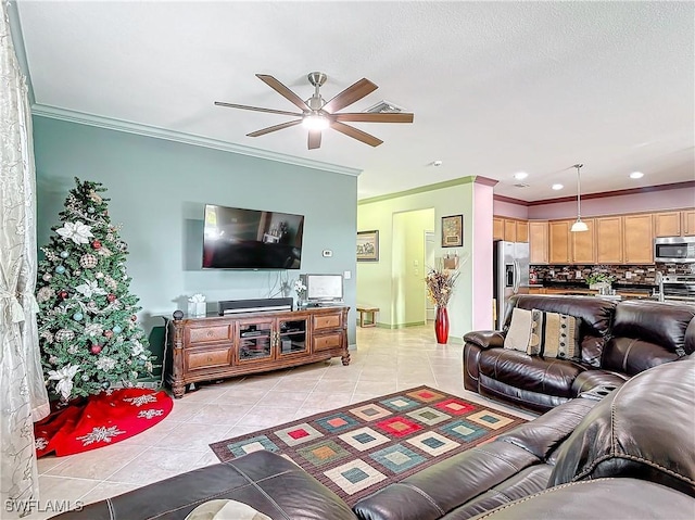 living room featuring ceiling fan, light tile patterned floors, and ornamental molding