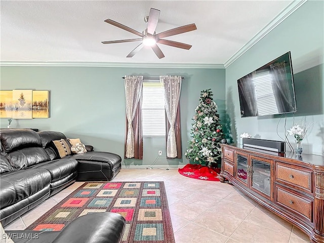 living room with ceiling fan, light tile patterned floors, and crown molding