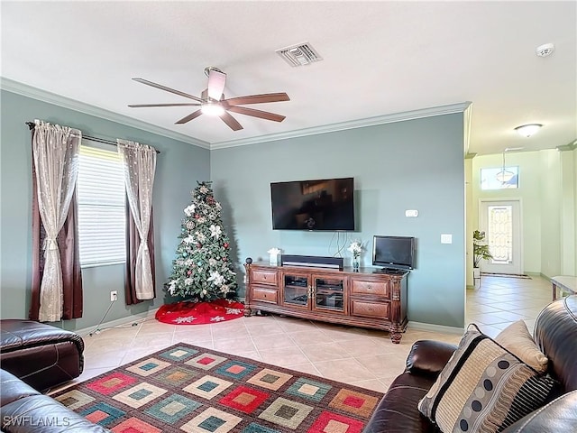 living room with crown molding, light tile patterned flooring, and ceiling fan