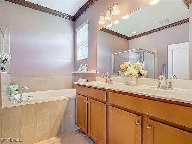 bathroom featuring crown molding, vanity, and shower with separate bathtub