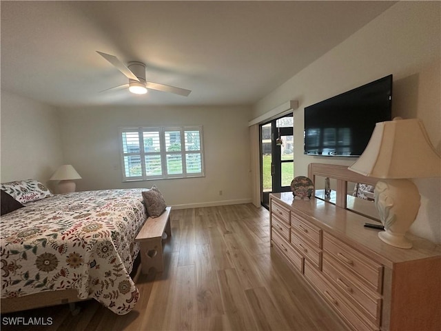 bedroom featuring access to outside, ceiling fan, and light hardwood / wood-style flooring