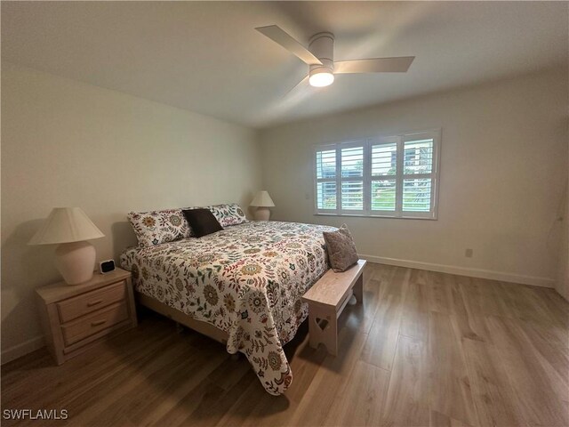 bedroom with hardwood / wood-style flooring and ceiling fan