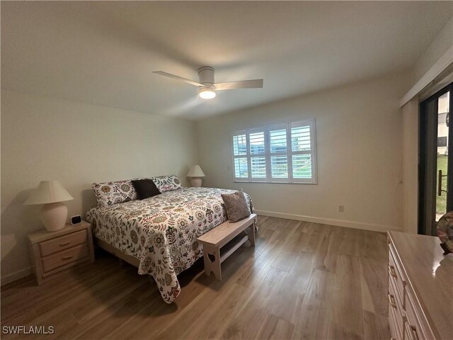 bedroom with hardwood / wood-style flooring and ceiling fan