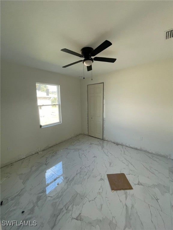 empty room with ceiling fan