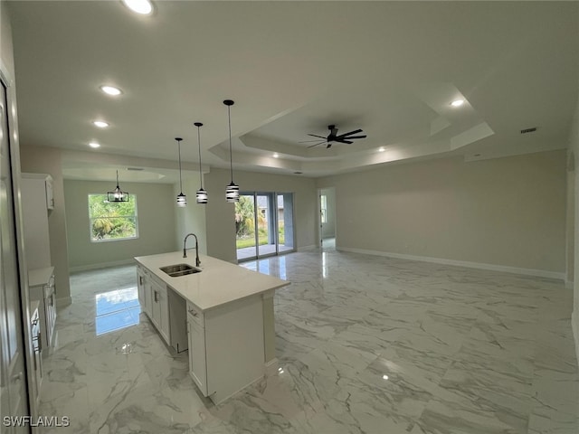 6024 Joplin Ave, Fort Myers, FL 33905 - kitchen with a tray ceiling, a sink, white cabinetry, open floor plan, and marble finish floor
