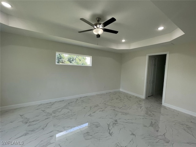 6024 Joplin Ave, Fort Myers, FL 33905 - empty room with baseboards, marble finish floor, ceiling fan, recessed lighting, and a raised ceiling