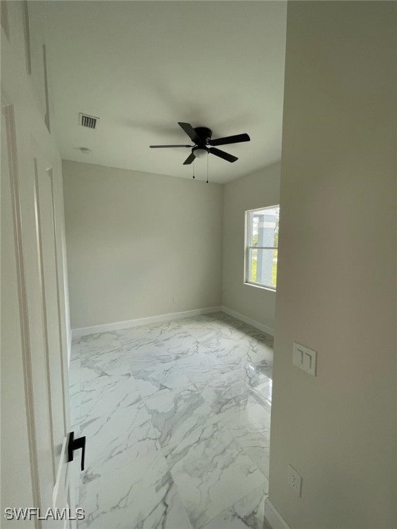 6024 Joplin Ave, Fort Myers, FL 33905 - spare room featuring marble finish floor, baseboards, visible vents, and a ceiling fan