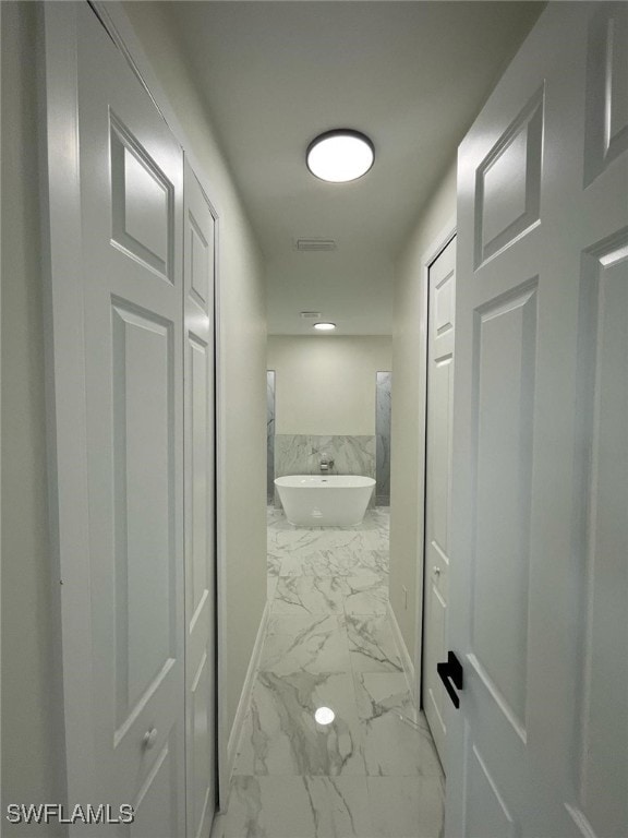 6024 Joplin Ave, Fort Myers, FL 33905 - corridor with baseboards and marble finish floor