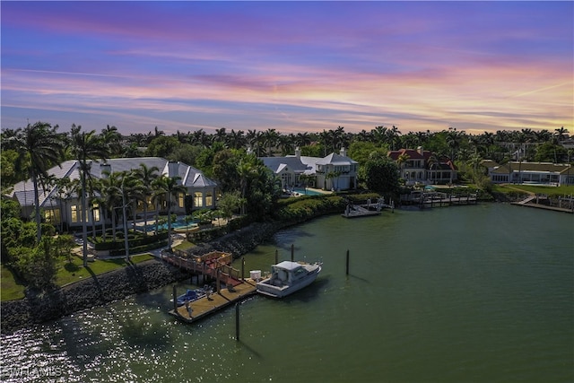 aerial view at dusk with a water view