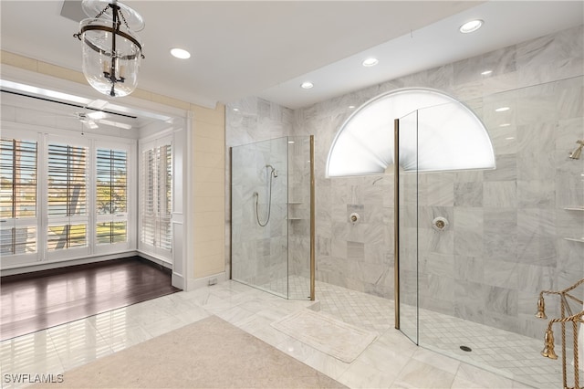 bathroom featuring a shower with door