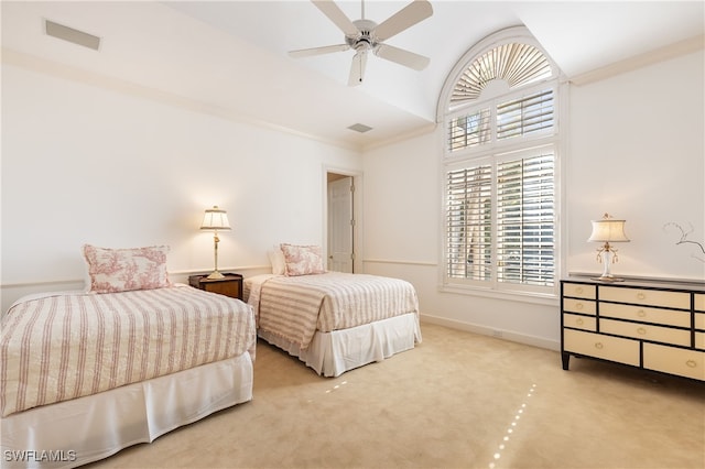 carpeted bedroom with multiple windows, ceiling fan, and crown molding