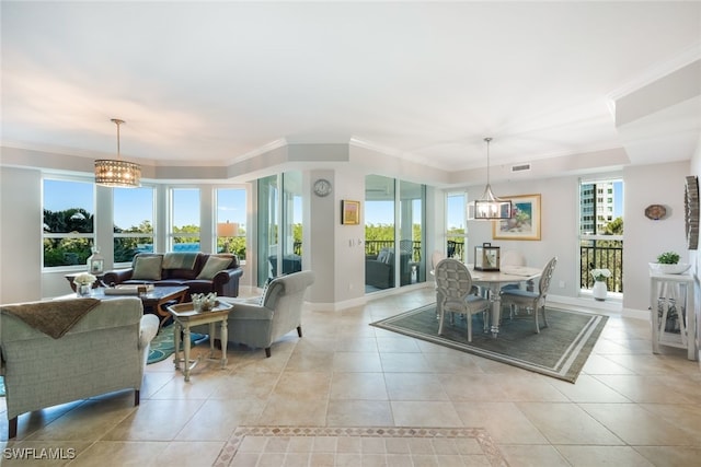 tiled dining area with crown molding and a notable chandelier