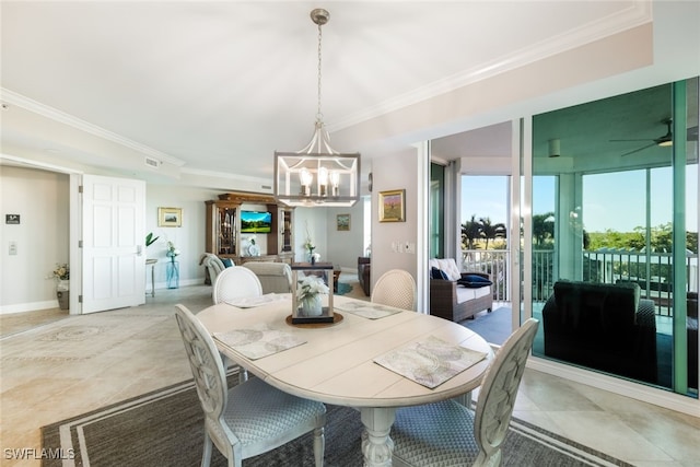 dining area featuring ceiling fan with notable chandelier and crown molding