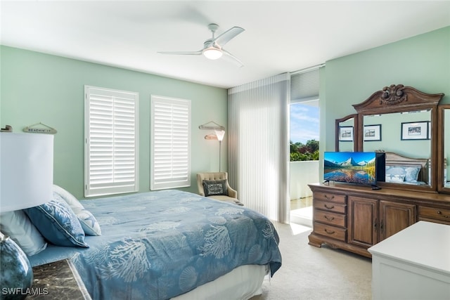 bedroom with ceiling fan and light colored carpet