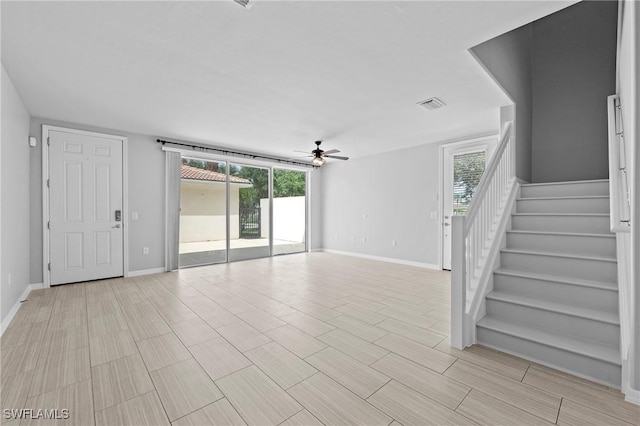 unfurnished living room featuring ceiling fan