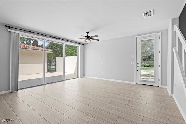 unfurnished room with ceiling fan