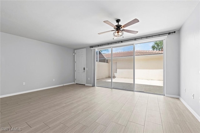 unfurnished bedroom featuring ceiling fan, access to outside, and light wood-type flooring