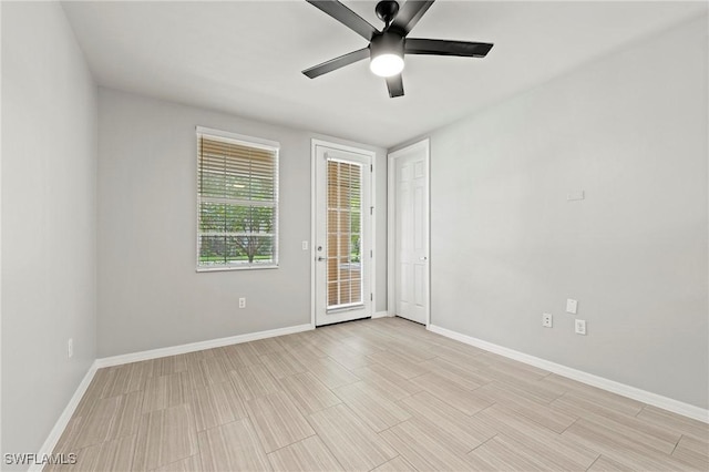 spare room with light hardwood / wood-style floors and ceiling fan