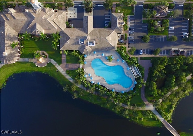 birds eye view of property with a water view