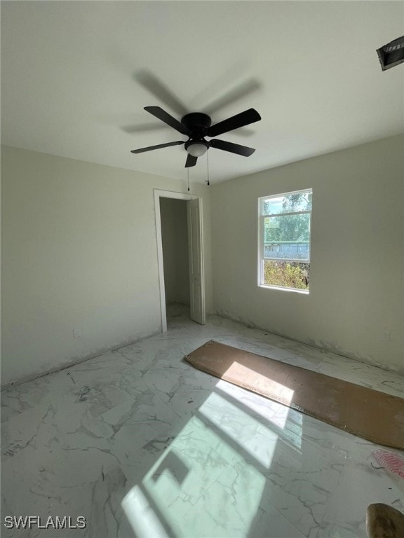 unfurnished room with ceiling fan