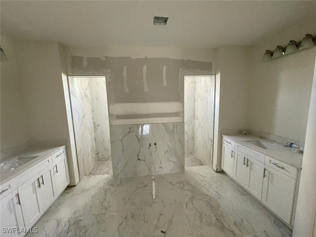 bathroom with a shower and vanity