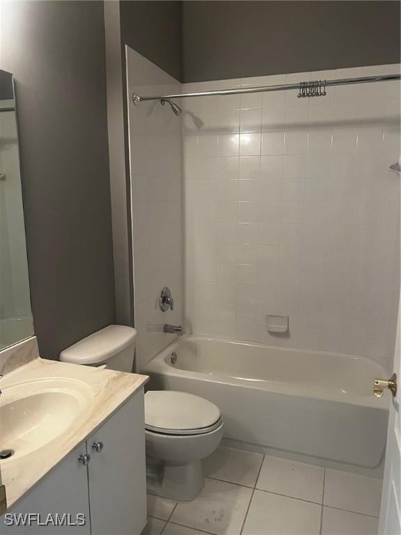 full bathroom with tile patterned flooring, vanity, toilet, and tiled shower / bath combo