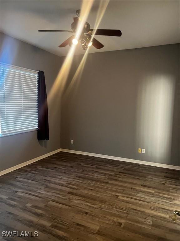 spare room featuring dark wood-type flooring