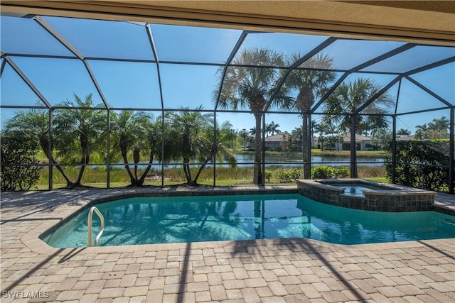 view of swimming pool featuring an in ground hot tub, a patio, a water view, and a lanai