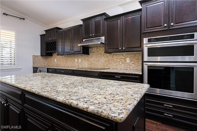 kitchen featuring black electric stovetop, dark hardwood / wood-style flooring, backsplash, stainless steel double oven, and crown molding