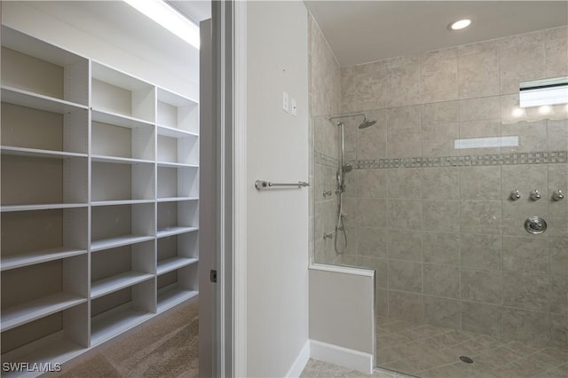 bathroom with tiled shower