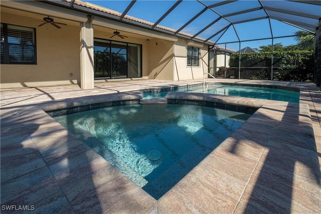 view of pool with a lanai, a patio area, and ceiling fan