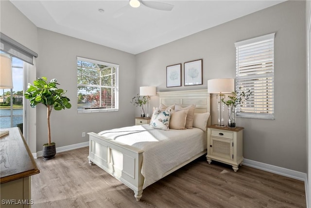 bedroom featuring hardwood / wood-style floors and ceiling fan