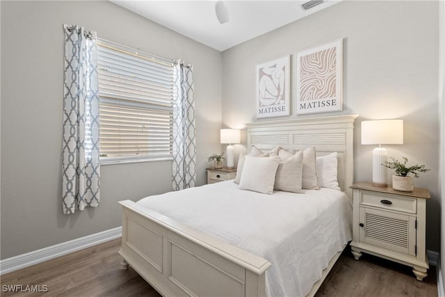 bedroom with ceiling fan and dark wood-type flooring