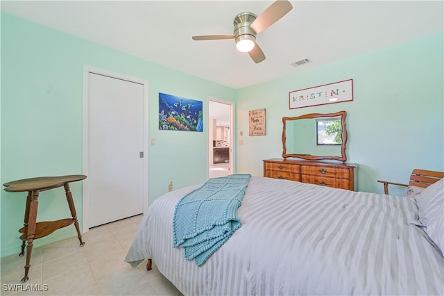 bedroom with ceiling fan and light tile patterned flooring