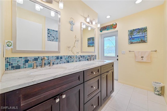 bathroom featuring vanity, backsplash, and tile patterned floors