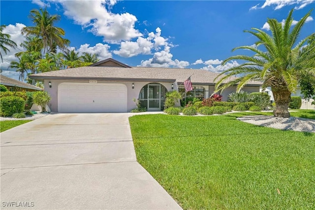 single story home featuring a front yard and a garage