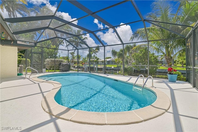 view of pool featuring a patio area and a lanai