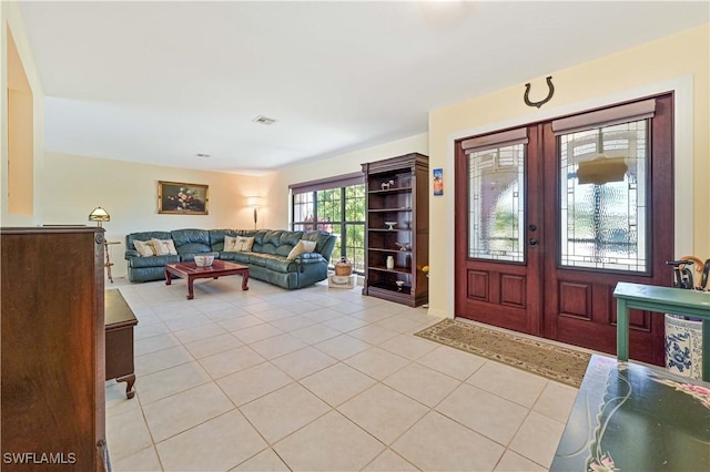 tiled entrance foyer featuring french doors