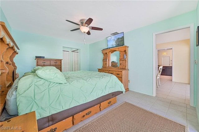 tiled bedroom featuring ceiling fan