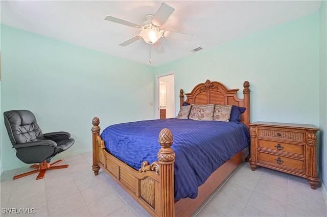 tiled bedroom with ceiling fan